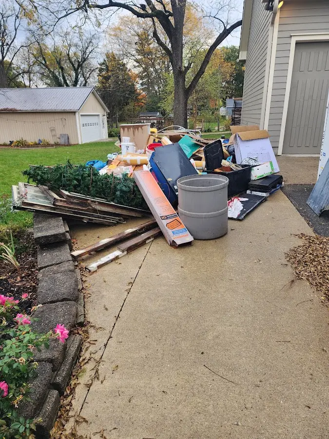 Dumpster being loaded with debris for 10 Yard Dumpster Rental in Princeton